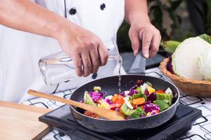 cooking vegetables in a frying pan